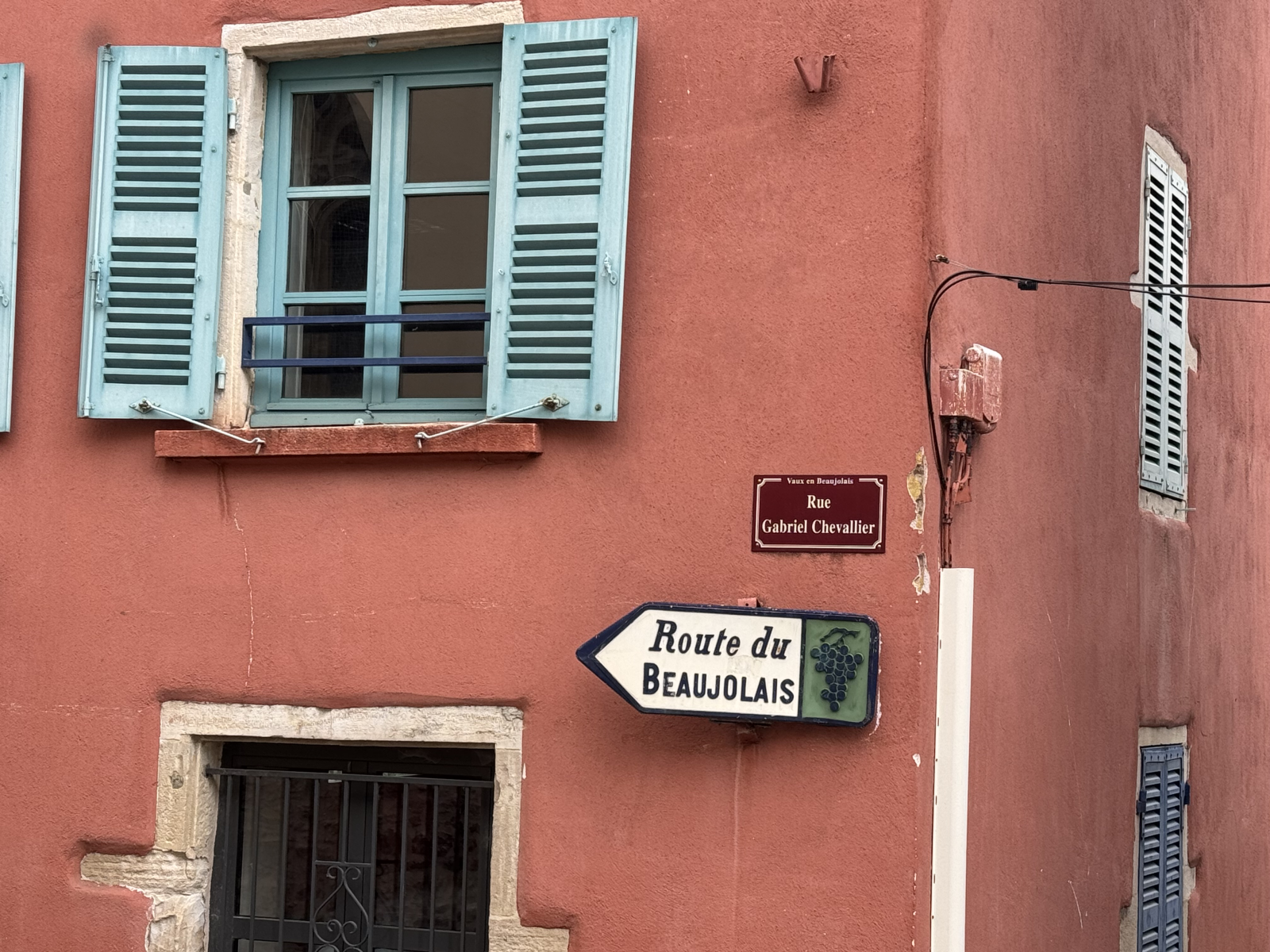 Road sign Road sign marking the Route de Beaujolais surrounded by vineyards